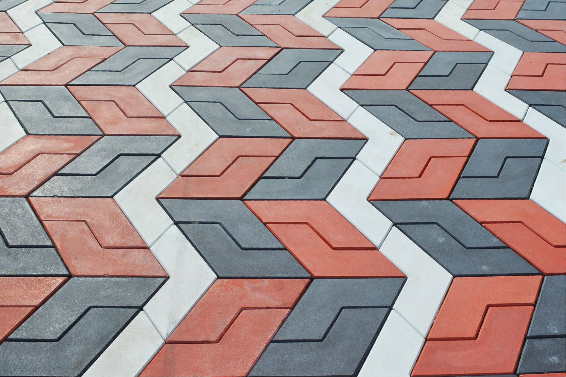 Chevron pattern concrete tiles in red, gray and white
